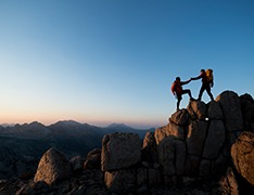 hikers scaling rocky terrain