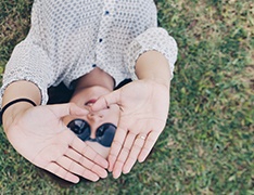 photo of woman using her hands as viewfinder